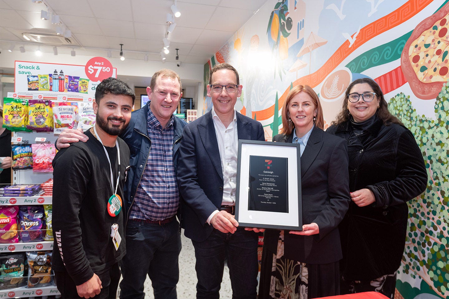 Team celebraing the re-launch of 7-Eleven Oakleigh