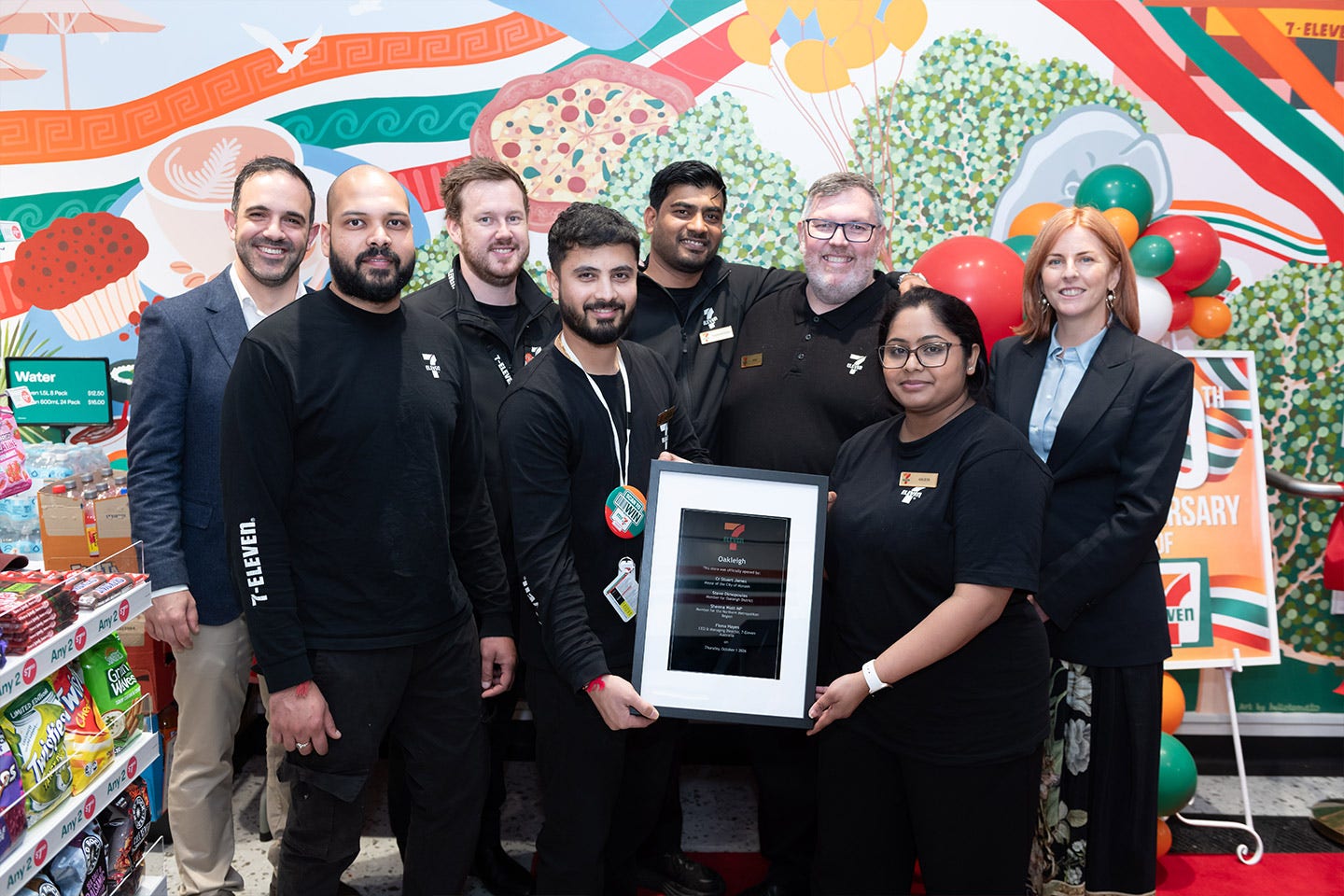 Team celebraing the re-launch of 7-Eleven Oakleigh