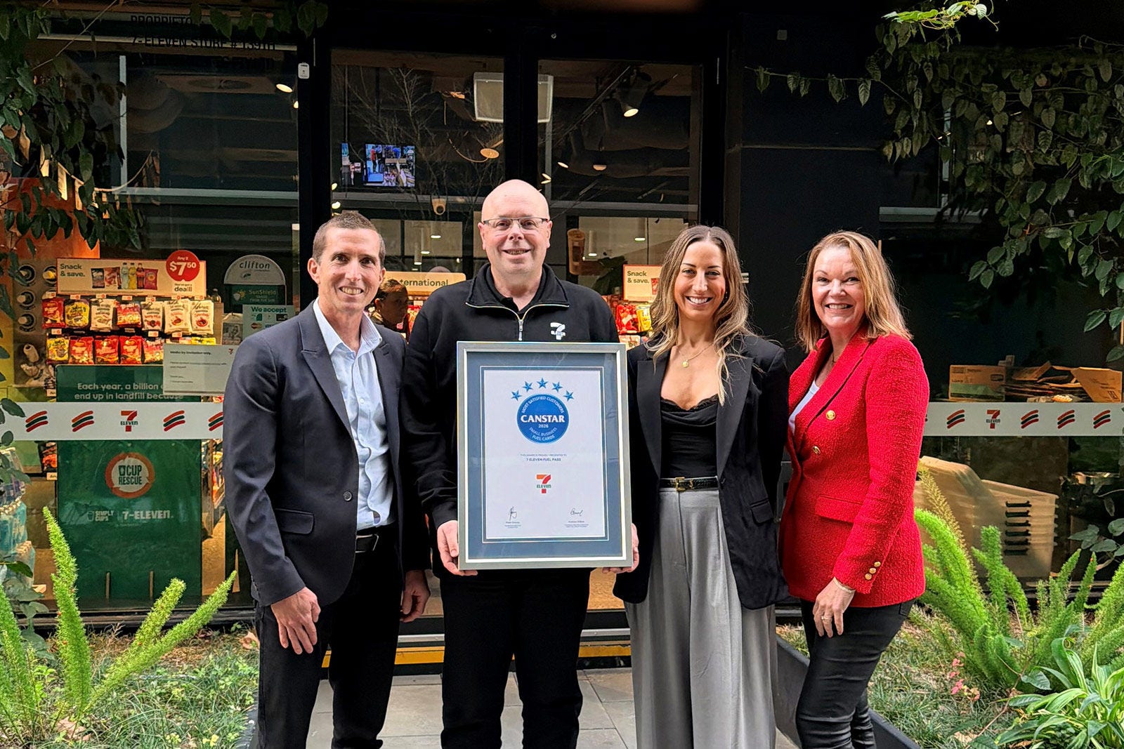 7-Eleven Fuel card team holding Canstar award