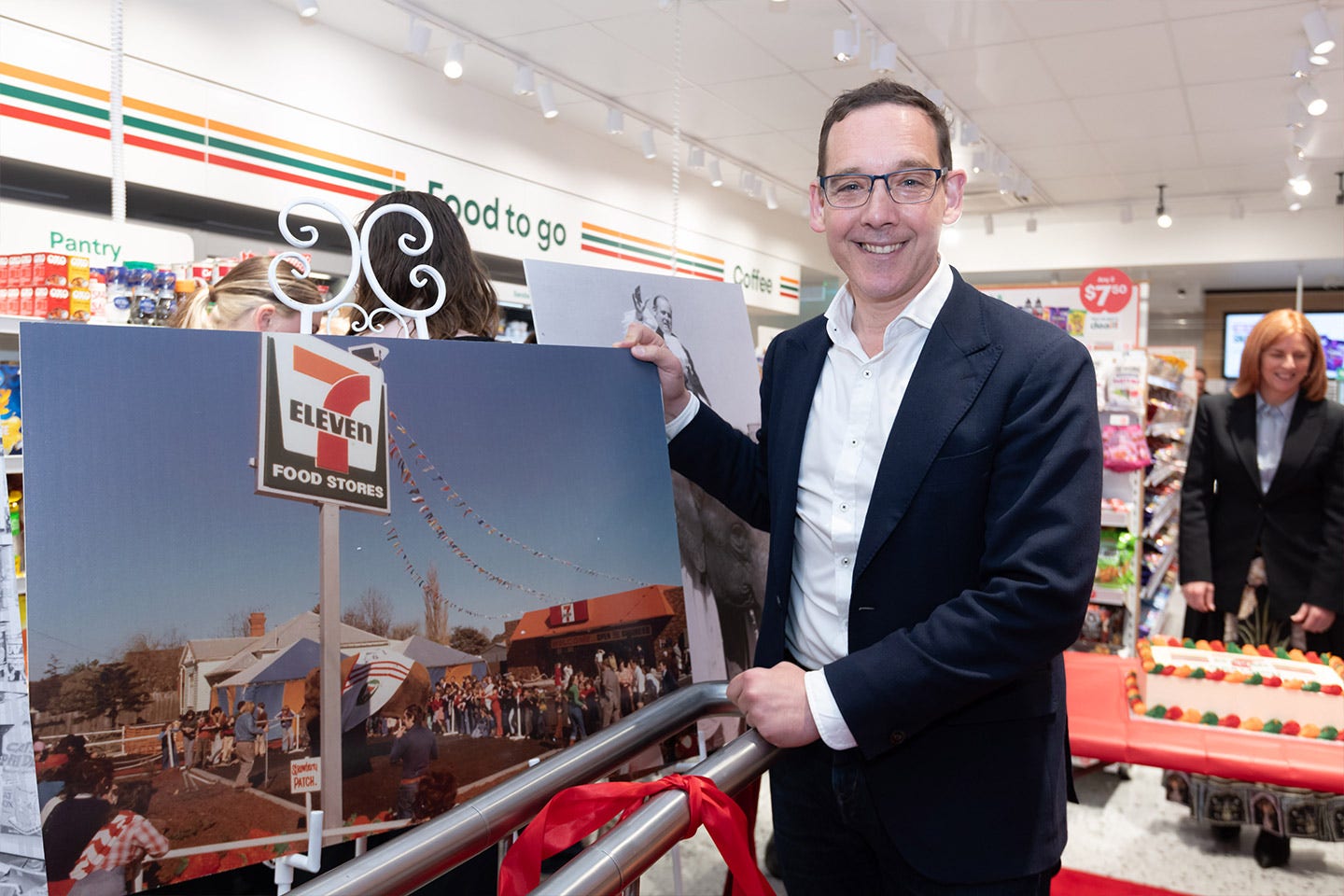 Team celebraing the re-launch of 7-Eleven Oakleigh