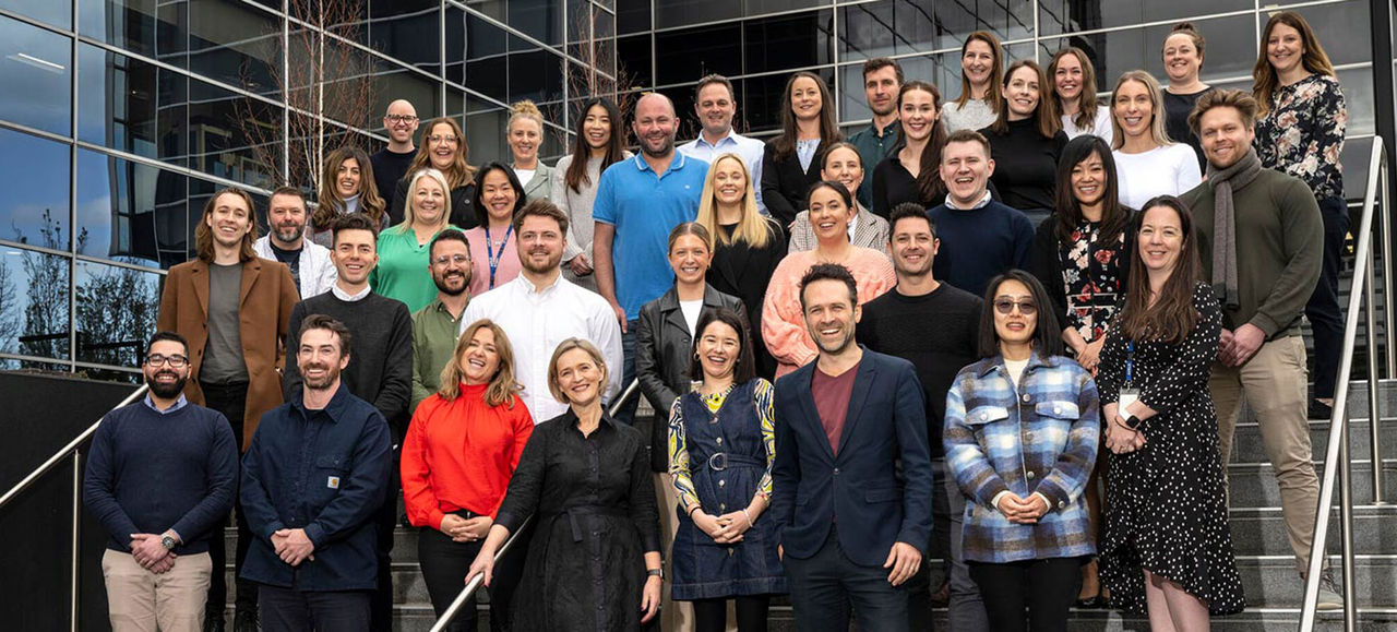 Image of head office staff posing for a team photo