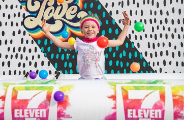 A young girl celebrating at the Colour Run