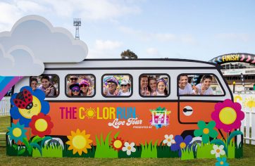 Participants smiling in the Colour Run bus
