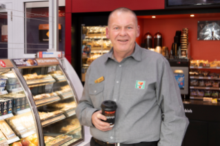 Franchisee holding coffee