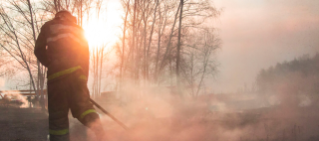 A fireman puts out bushfires.