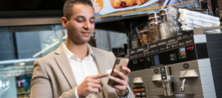 Man looking at daily deals on his phone.