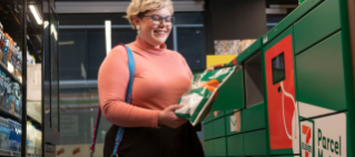 Woman dropping off parcel at ParcelMate drop off.