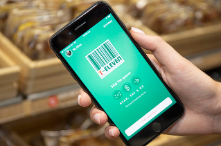 7-Eleven app on a phone. The phone is being held in someone's hand.