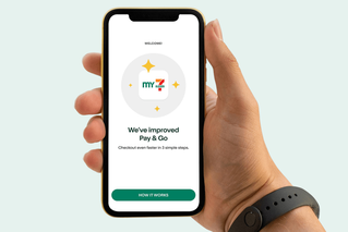 Image of hand holding a smart-phone. On the smart-phone is the My 7-Eleven App, with a message "We've improved Pay & Go. Checkout faster in 3 simple steps"